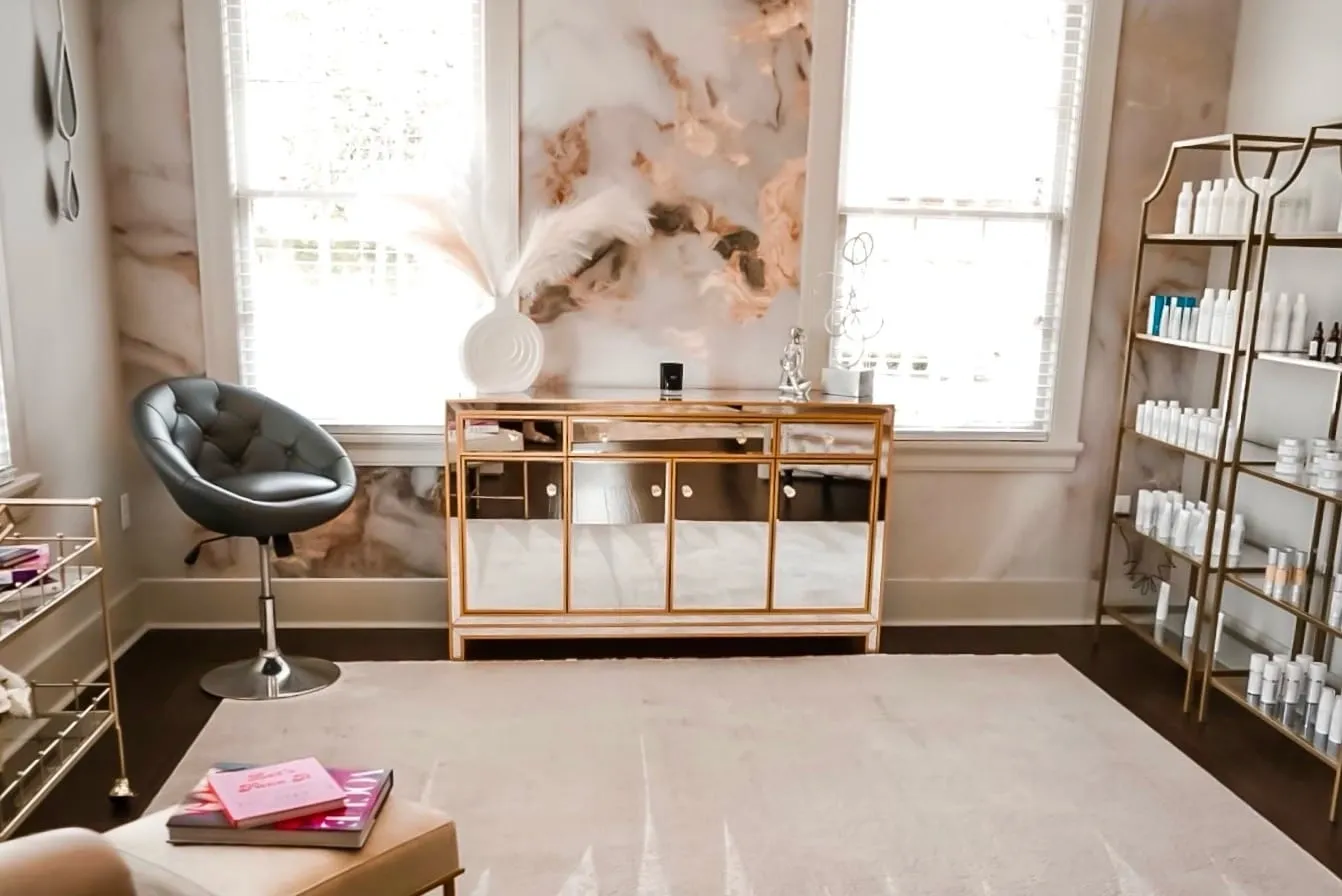 A room with a mirror and a chair